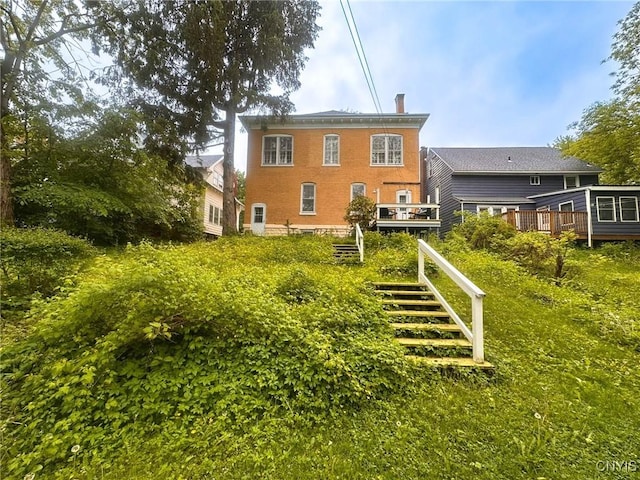 169 Pleasant St, Utica, NY 13501 - rear view of property with a deck and stairs
