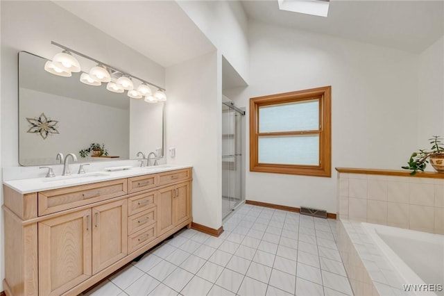 6157 Walnut Creek Ct, Clarence, NY 14051 - bathroom featuring double vanity, a bath, a shower with door, and baseboards