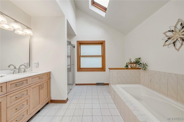6157 Walnut Creek Ct, Clarence, NY 14051 - full bath featuring vanity, a skylight, a garden tub, a stall shower, and high vaulted ceiling