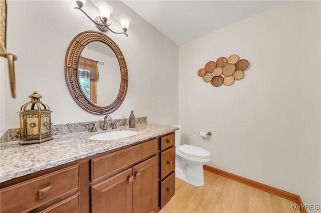 6157 Walnut Creek Ct, Clarence, NY 14051 - bathroom featuring vanity, toilet, and baseboards
