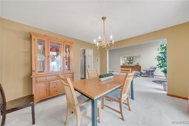 6157 Walnut Creek Ct, Clarence, NY 14051 - dining space with light carpet and a chandelier