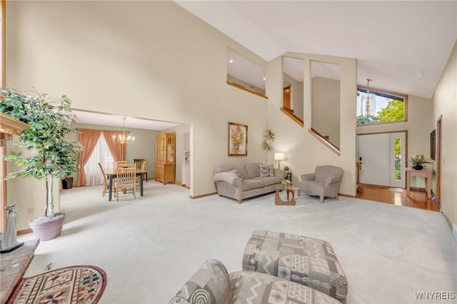 6157 Walnut Creek Ct, Clarence, NY 14051 - living room with high vaulted ceiling, a chandelier, carpet flooring, and baseboards
