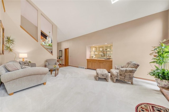 6157 Walnut Creek Ct, Clarence, NY 14051 - carpeted living room featuring vaulted ceiling and baseboards