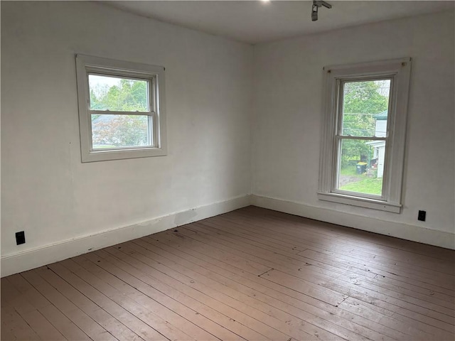 6940 County Highway 18, Plainfield, NY 13491 - spare room featuring hardwood / wood-style floors and baseboards