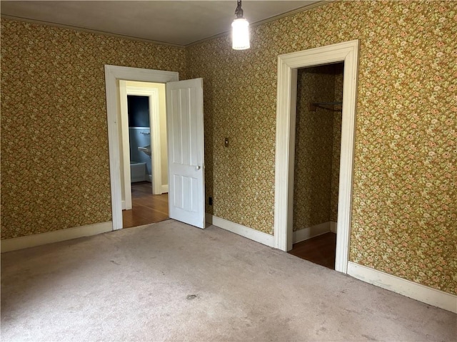 6940 County Highway 18, Plainfield, NY 13491 - unfurnished bedroom with carpet floors, wallpapered walls, and ornamental molding
