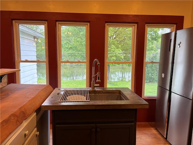 6940 County Highway 18, Plainfield, NY 13491 - kitchen featuring freestanding refrigerator, a sink, plenty of natural light, and light wood-style floors