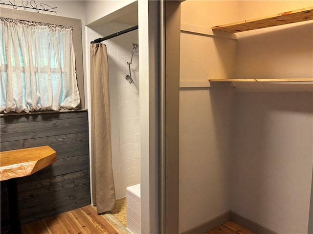 6940 County Highway 18, Plainfield, NY 13491 - bathroom featuring wood finished floors and a tile shower