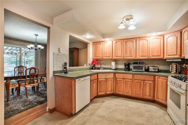 12 N Hill Dr, West Seneca, NY 14224 - kitchen featuring white appliances, a sink, a chandelier, dark countertops, and decorative backsplash