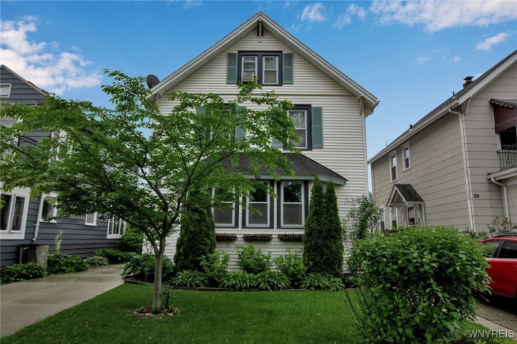 48 Groveland St, Buffalo, NY 14214 - view of front of home with a front lawn