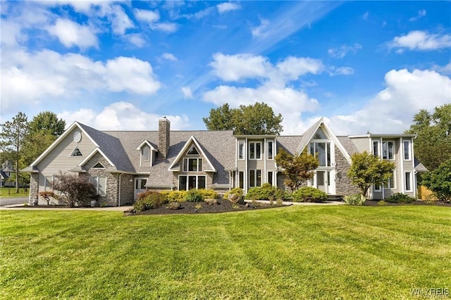 60 Gaylord Ct, Elma, NY 14059 - view of front of house with a chimney, a front yard, and stone siding