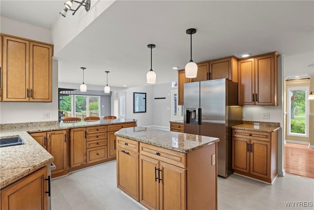 60 Gaylord Ct, Elma, NY 14059 - kitchen featuring stainless steel refrigerator with ice dispenser, brown cabinetry, recessed lighting, light stone counters, and a peninsula