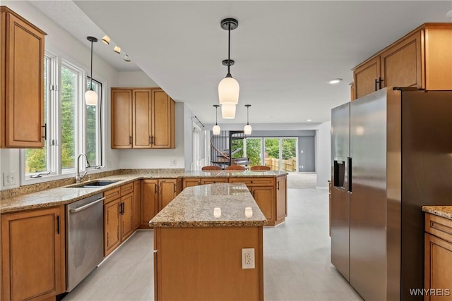 60 Gaylord Ct, Elma, NY 14059 - kitchen with appliances with stainless steel finishes, a peninsula, a sink, and brown cabinets