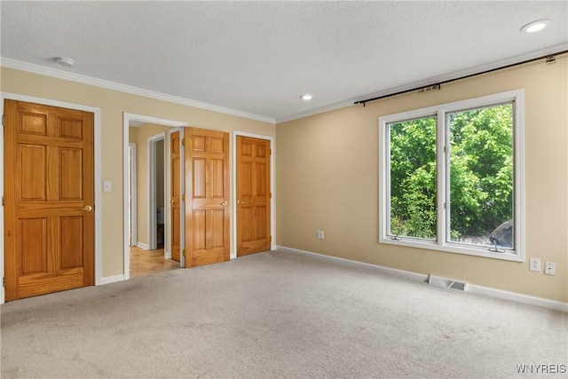60 Gaylord Ct, Elma, NY 14059 - unfurnished bedroom with carpet flooring, a textured ceiling, ornamental molding, and baseboards