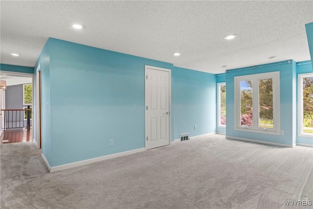 60 Gaylord Ct, Elma, NY 14059 - unfurnished room with carpet, a textured ceiling, baseboards, and recessed lighting