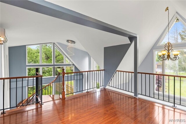 60 Gaylord Ct, Elma, NY 14059 - spare room featuring a chandelier, wood finished floors, and lofted ceiling