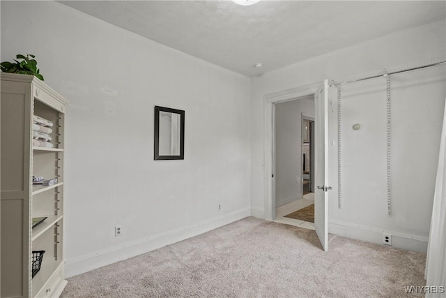 1822 Grover Rd, Aurora, NY 14052 - unfurnished bedroom with carpet and baseboards