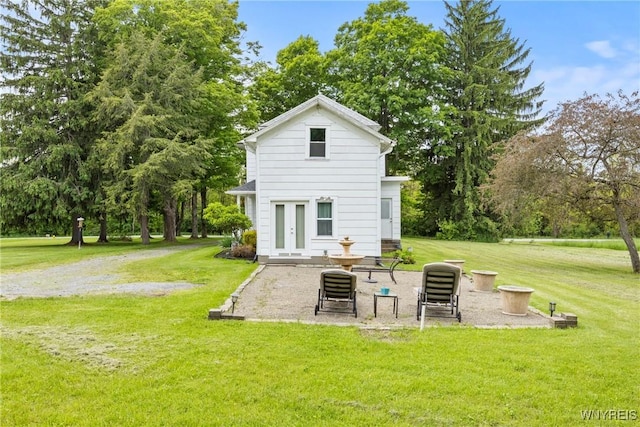 1822 Grover Rd, Aurora, NY 14052 - back of property featuring french doors, a lawn, and view of wooded area