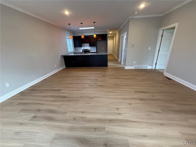 10 Platten Dr, Elbridge, NY 13080 - unfurnished living room featuring crown molding, light wood-style floors, recessed lighting, and baseboards