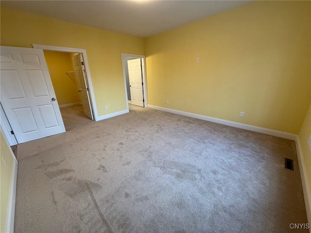 10 Platten Dr, Elbridge, NY 13080 - unfurnished bedroom featuring a spacious closet, baseboards, carpet floors, and a closet