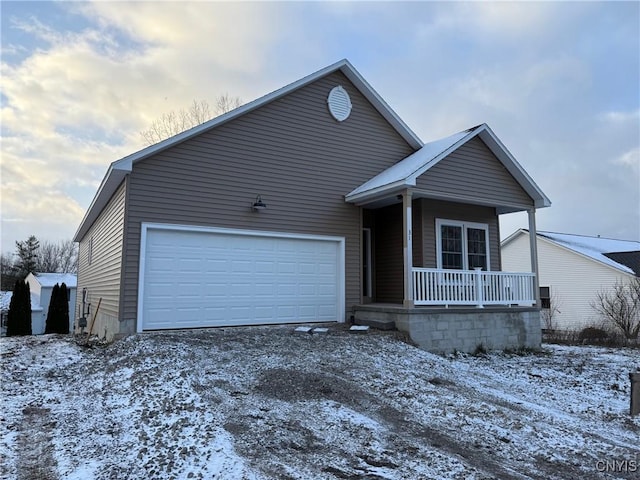 10 Platten Dr, Elbridge, NY 13080 - view of front of house featuring covered porch, gravel driveway, and a garage