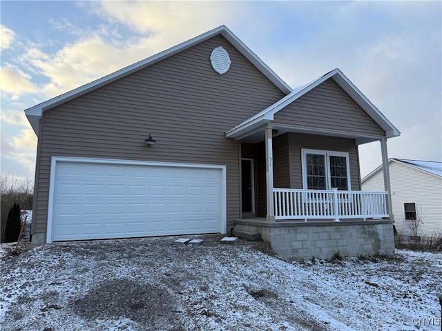 10 Platten Dr, Elbridge, NY 13080 - view of front facade with covered porch, a garage, and driveway