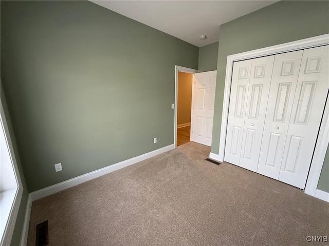 10 Platten Dr, Elbridge, NY 13080 - unfurnished bedroom featuring carpet, baseboards, and a closet