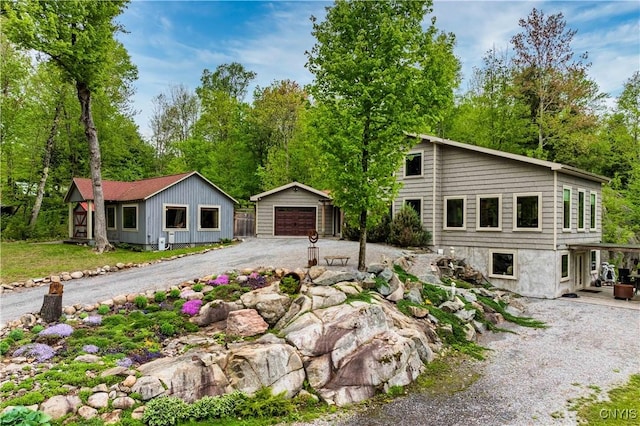 161 Portaferry Lake Dr, Pitcairn, NY 13648 - view of front of house featuring an outdoor structure, a garage, and driveway