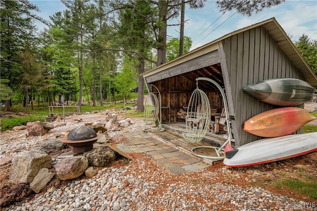 161 Portaferry Lake Dr, Pitcairn, NY 13648 - view of patio with an outbuilding and an outdoor fire pit