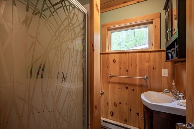 161 Portaferry Lake Dr, Pitcairn, NY 13648 - full bathroom with a baseboard heating unit, a shower stall, and vanity