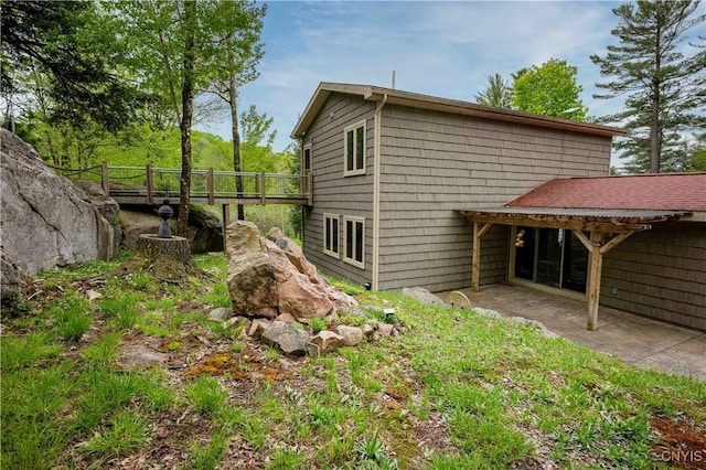 161 Portaferry Lake Dr, Pitcairn, NY 13648 - view of property exterior with a patio