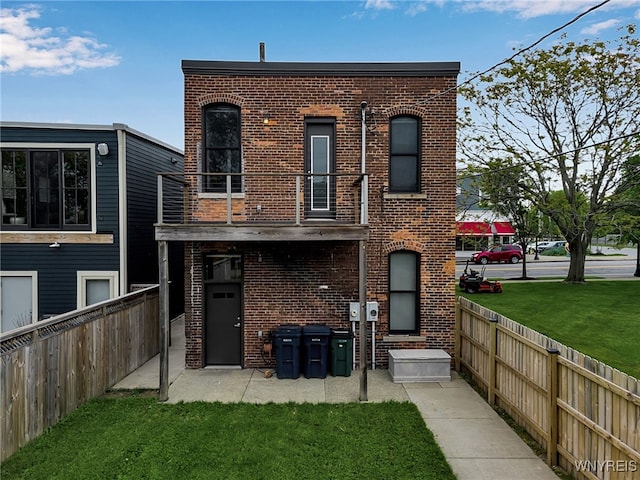 871 Seneca St, Buffalo, NY 14210 - back of property featuring a balcony and brick siding