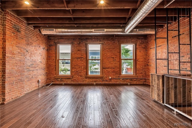 871 Seneca St, Buffalo, NY 14210 - unfurnished room featuring wood-type flooring and brick wall