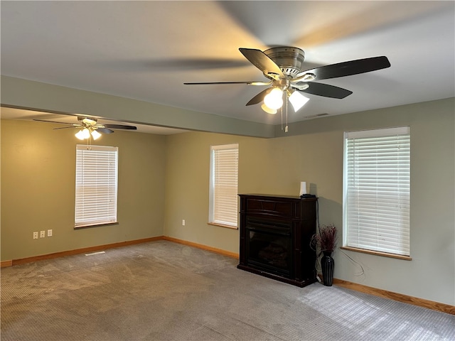 19 Hickory St, Hanover, NY 14136 - unfurnished living room featuring carpet flooring, a ceiling fan, baseboards, and a fireplace