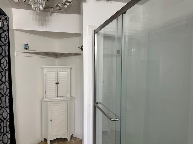 19 Hickory St, Hanover, NY 14136 - full bathroom featuring a stall shower, tile patterned flooring, and a chandelier