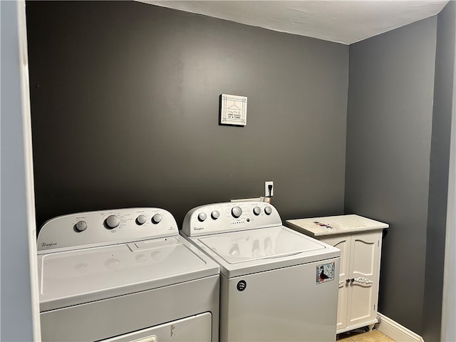 19 Hickory St, Hanover, NY 14136 - washroom with cabinet space, washing machine and clothes dryer, and baseboards