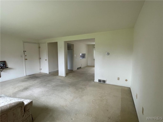 75 Old Lyme Dr Unit 2, Amherst, NY 14221 - unfurnished living room with light colored carpet
