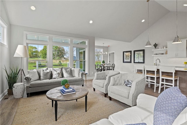 35 Chase Meadow Trl, Mendon, NY 14472 - living room featuring wood finished floors, high vaulted ceiling, recessed lighting, and baseboards