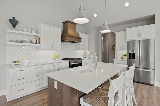 35 Chase Meadow Trl, Mendon, NY 14472 - kitchen featuring stainless steel appliances, premium range hood, a sink, light wood-style floors, and recessed lighting
