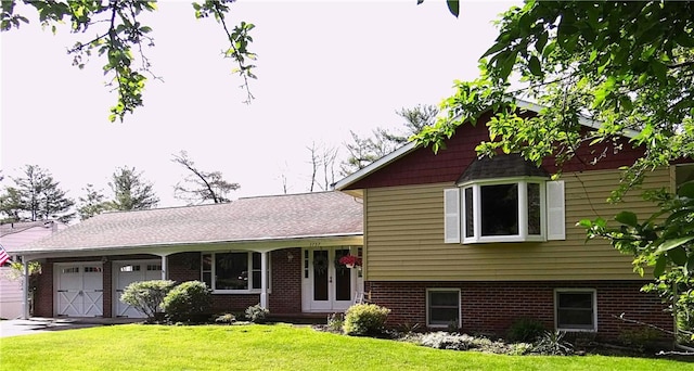 1737 Genesee Rd, Elmira, NY 14905 - view of front of home featuring an attached garage, a front yard, driveway, and brick siding