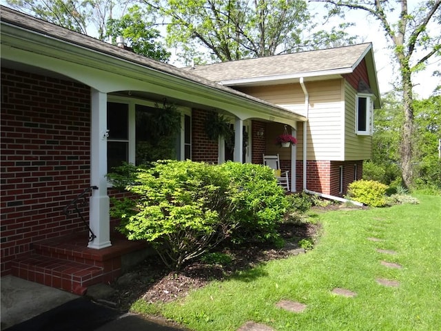 1737 Genesee Rd, Elmira, NY 14905 - view of side of home with brick siding, a yard, and a shingled roof