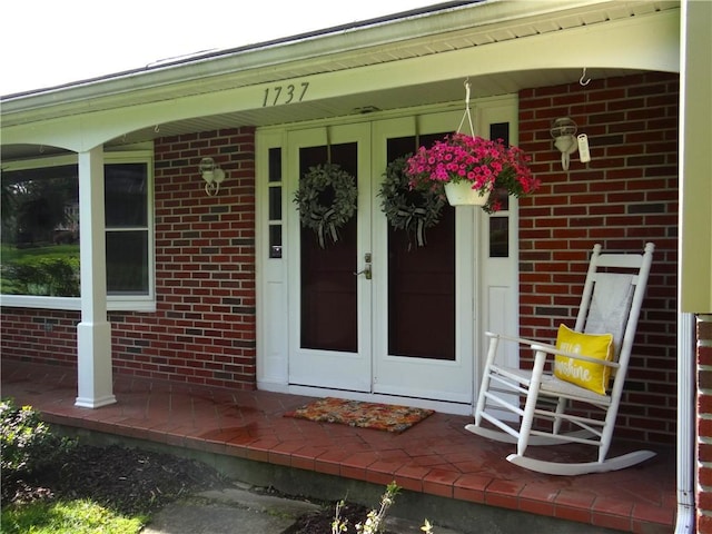 1737 Genesee Rd, Elmira, NY 14905 - doorway to property featuring french doors, brick siding, and a porch