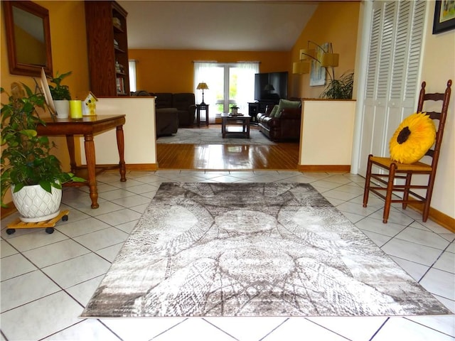 1737 Genesee Rd, Elmira, NY 14905 - living room featuring light tile patterned floors and baseboards