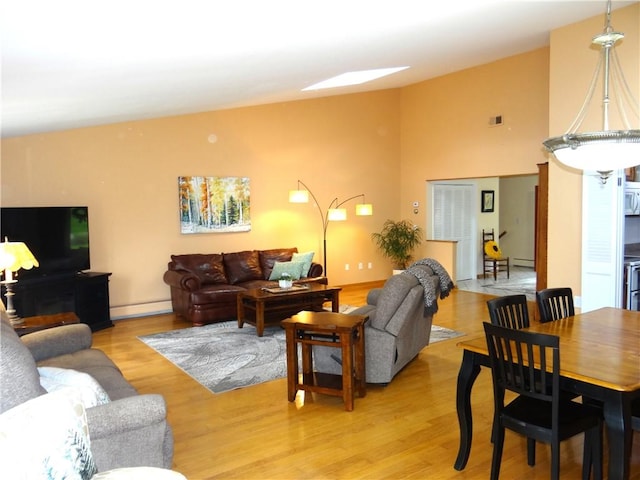1737 Genesee Rd, Elmira, NY 14905 - living room featuring baseboard heating and light wood-style floors
