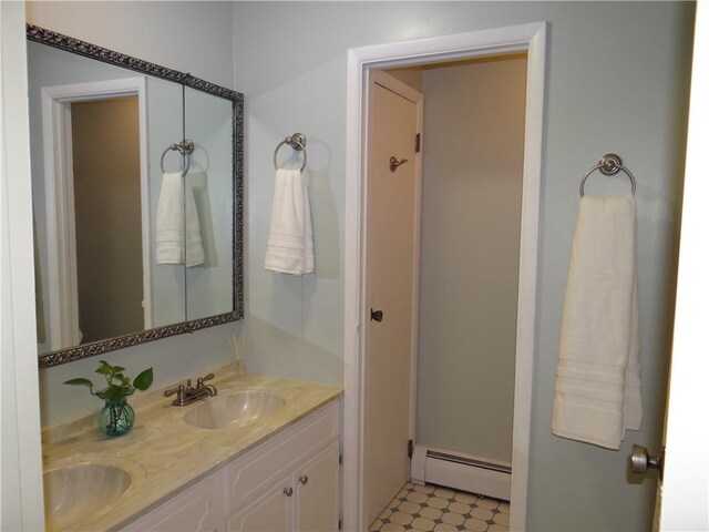 1737 Genesee Rd, Elmira, NY 14905 - bathroom with a baseboard heating unit, double vanity, and tile patterned floors