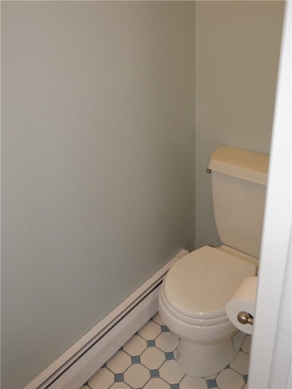 1737 Genesee Rd, Elmira, NY 14905 - bathroom with toilet and a baseboard heating unit