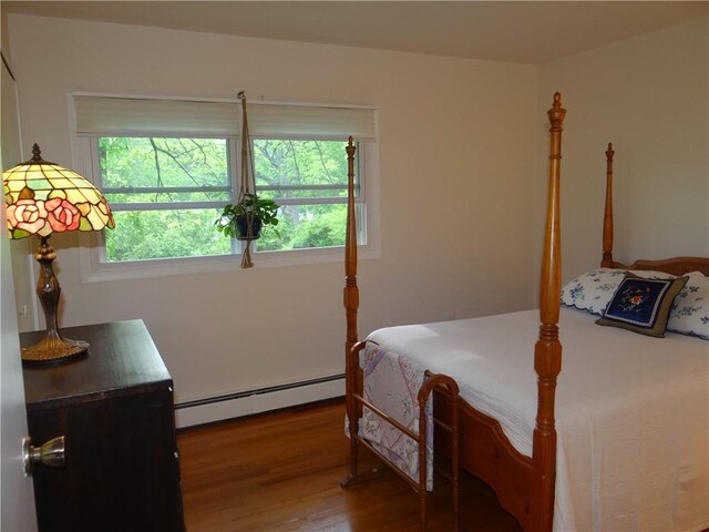 1737 Genesee Rd, Elmira, NY 14905 - bedroom featuring a baseboard radiator and wood finished floors