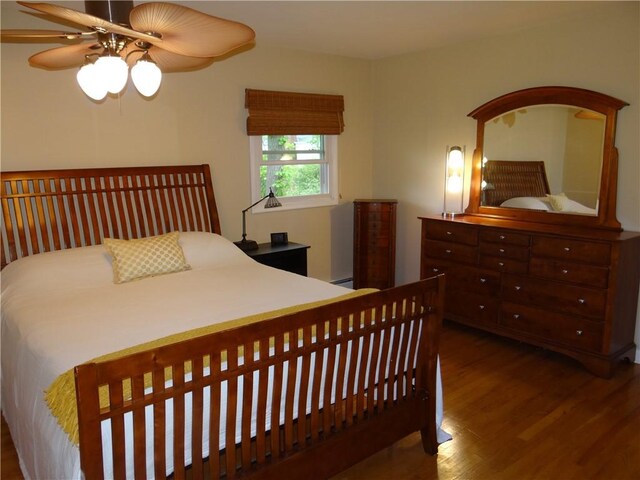 1737 Genesee Rd, Elmira, NY 14905 - bedroom with wood finished floors, a baseboard radiator, and ceiling fan