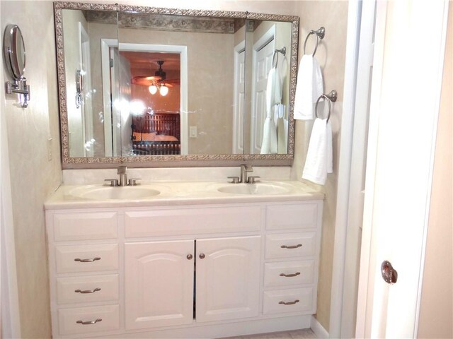 1737 Genesee Rd, Elmira, NY 14905 - bathroom featuring double vanity, ceiling fan, and ensuite bathroom