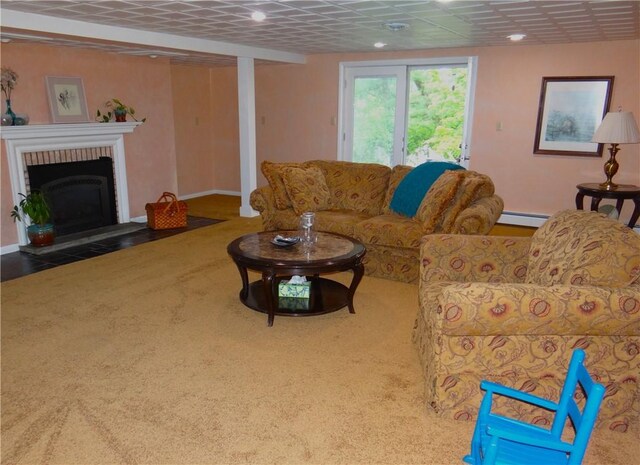 1737 Genesee Rd, Elmira, NY 14905 - carpeted living area with a baseboard heating unit and a fireplace