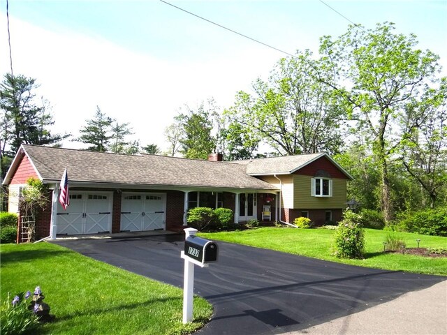 1737 Genesee Rd, Elmira, NY 14905 - split level home with an attached garage, brick siding, driveway, a front yard, and a chimney